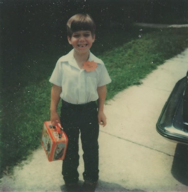 Me holding my lunch box on the first day of kindergarten in 1979.