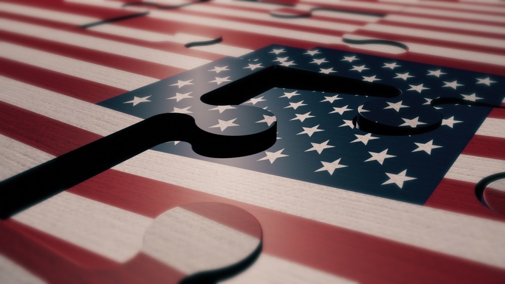 Image of an American flag puzzle with the pieces not quite lining up perfectly.